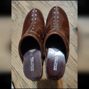 Michael Kors leather upper clogs.